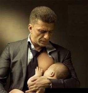 Man breastfeeding his son
